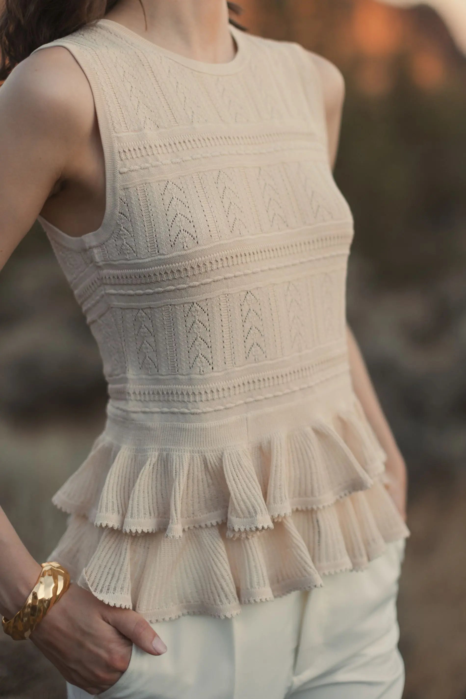 Beige Sleeveless High Neck Knit Top With Ruffle Hem